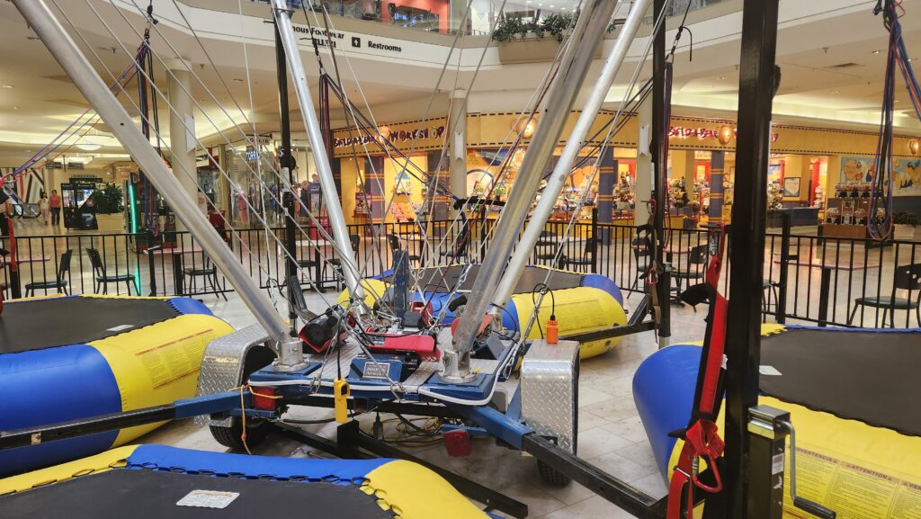 Family entertainment center bungee trampoline equipment located inside The Crossroads Mall